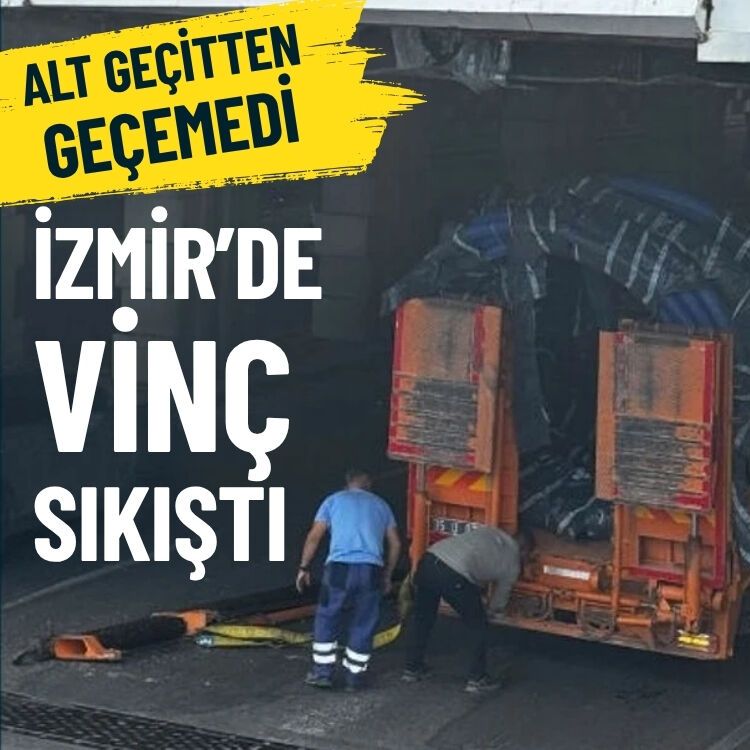 Alt geçitten geçemedi… İzmir’de vinç sıkıştı